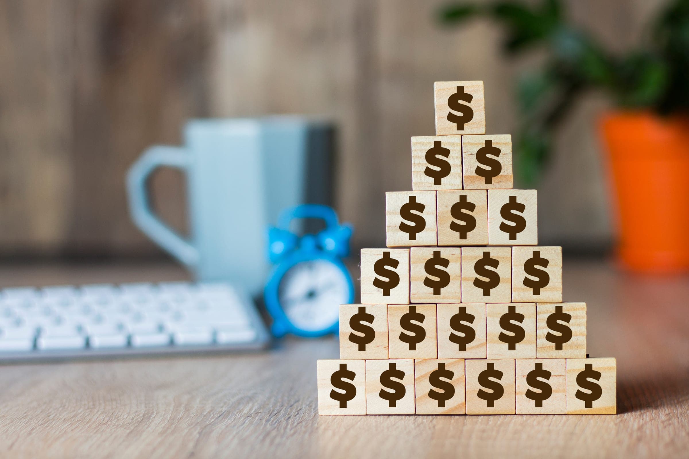 Stacked dollar blocks representing SMSF financial planning for 2026.