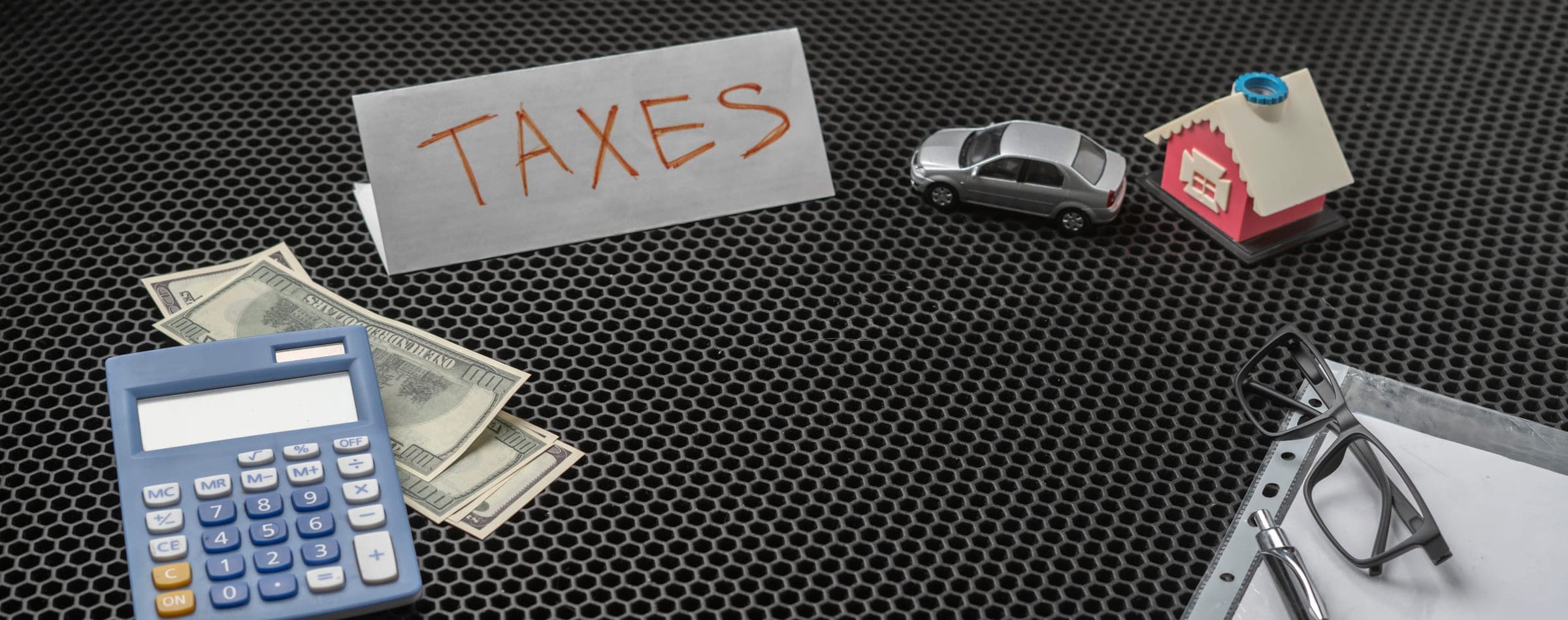 Calculator, money, and tax sign illustrating SMSF income traps.