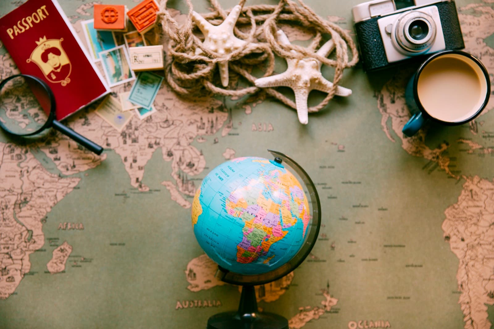 A globe and passport on a vintage world map