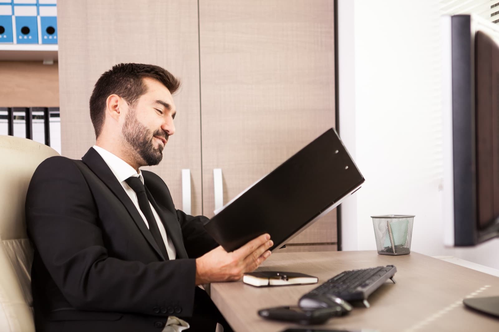 A professional reviewing documents in an office
