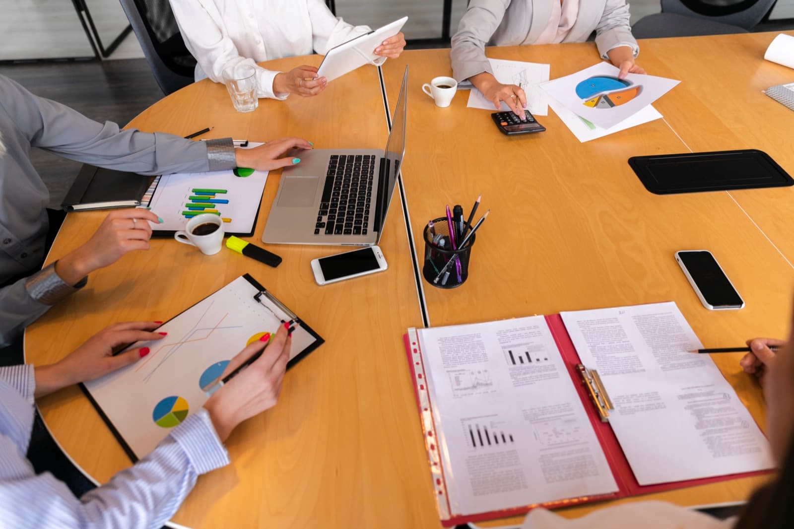 A team reviewing investment charts at a table