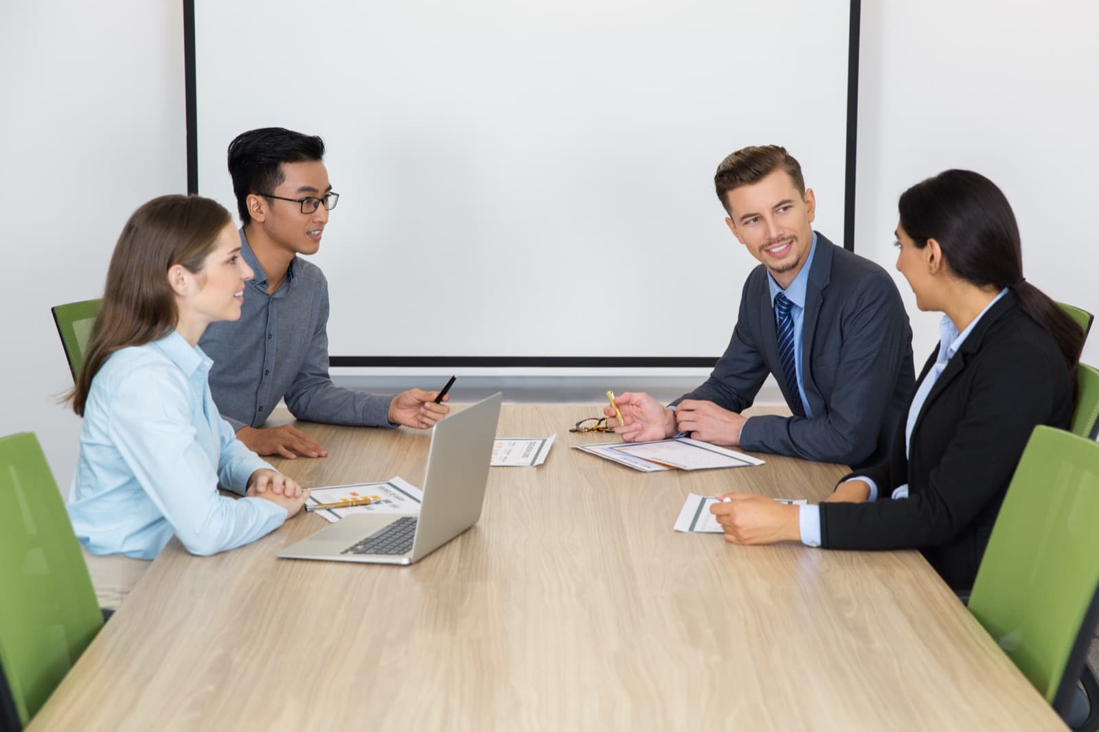 Business people meeting around a boardroom table