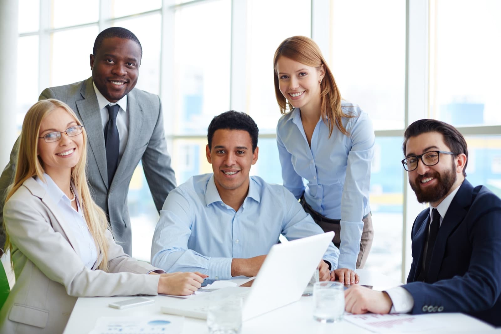 A group of professionals gathered around a table