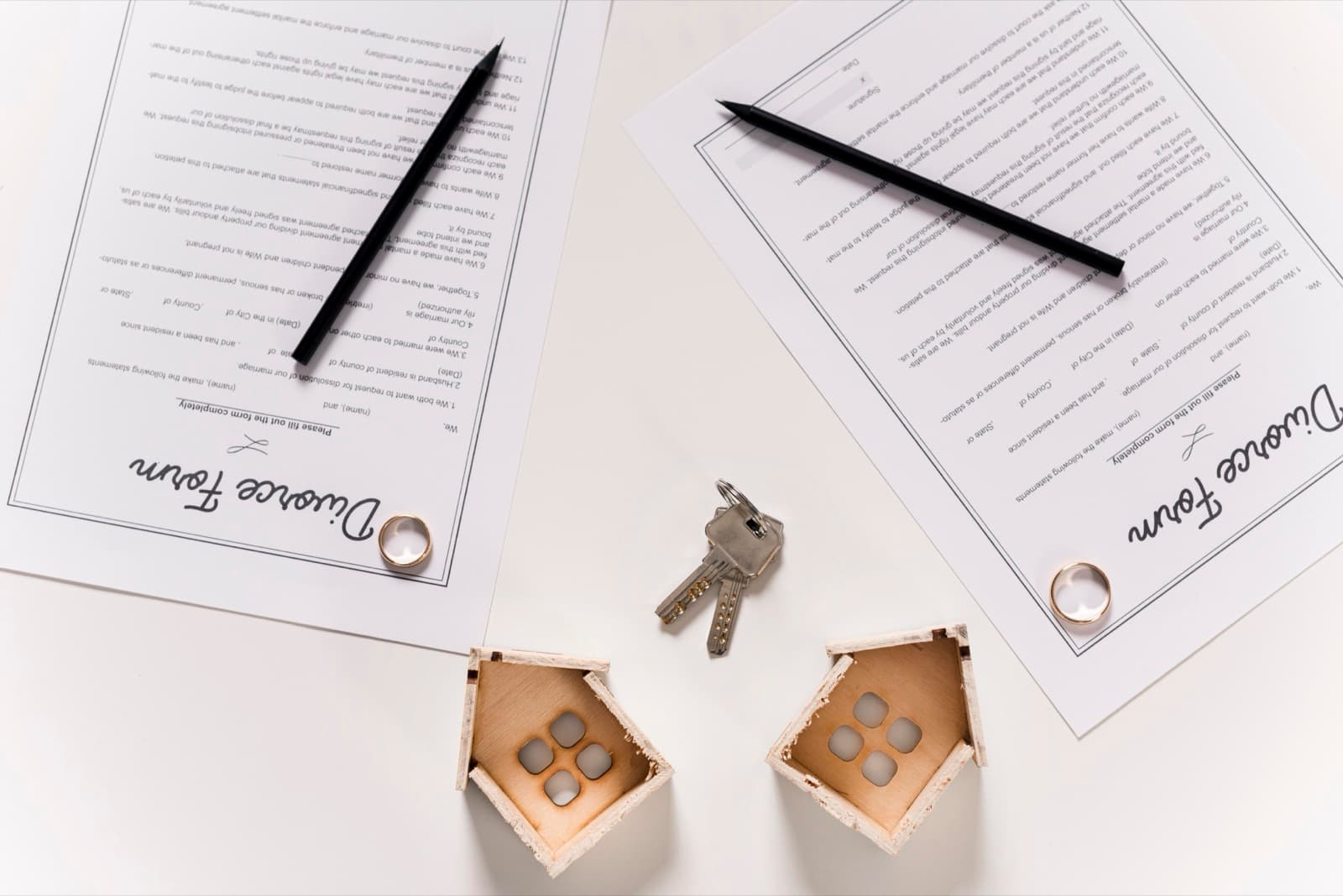 Documents and rings on a table representing a separation