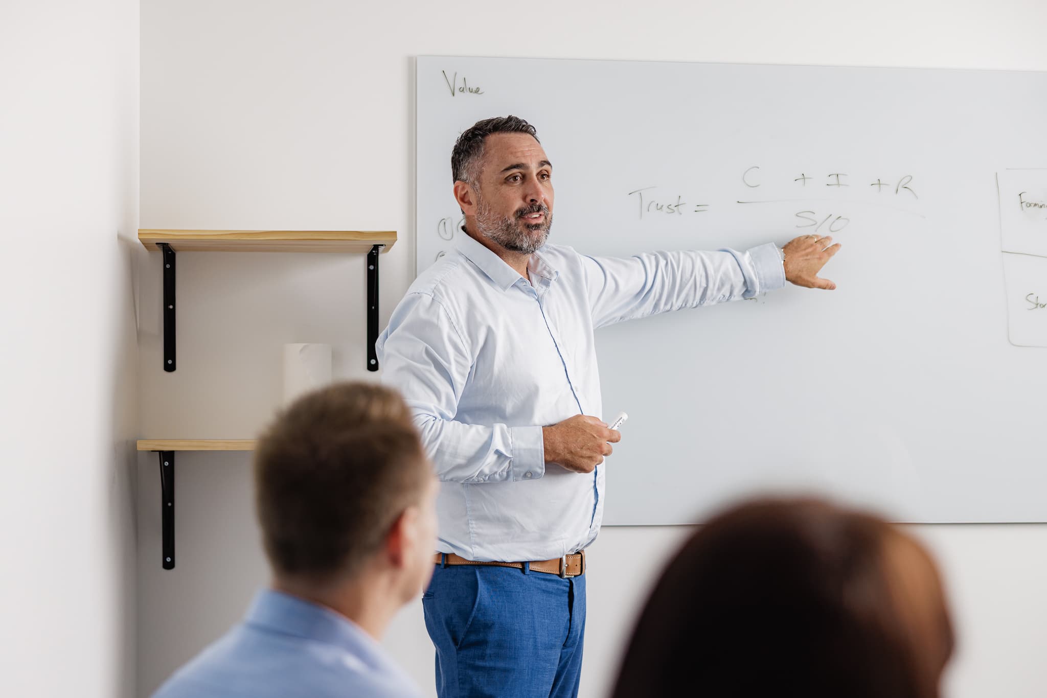 Small business owner reviewing accounts with an accountant in Brisbane