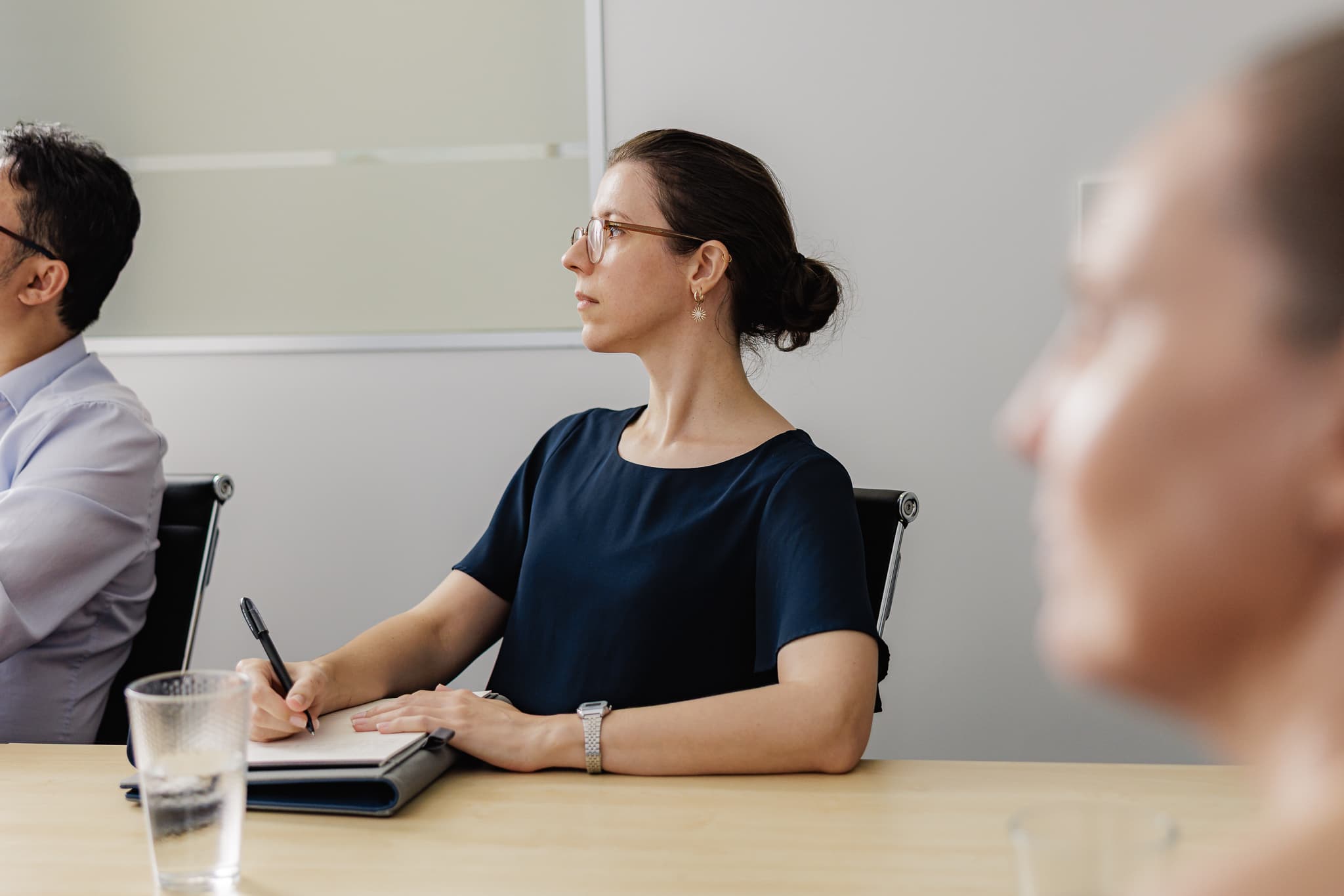 Growing business team reviewing performance numbers with an adviser