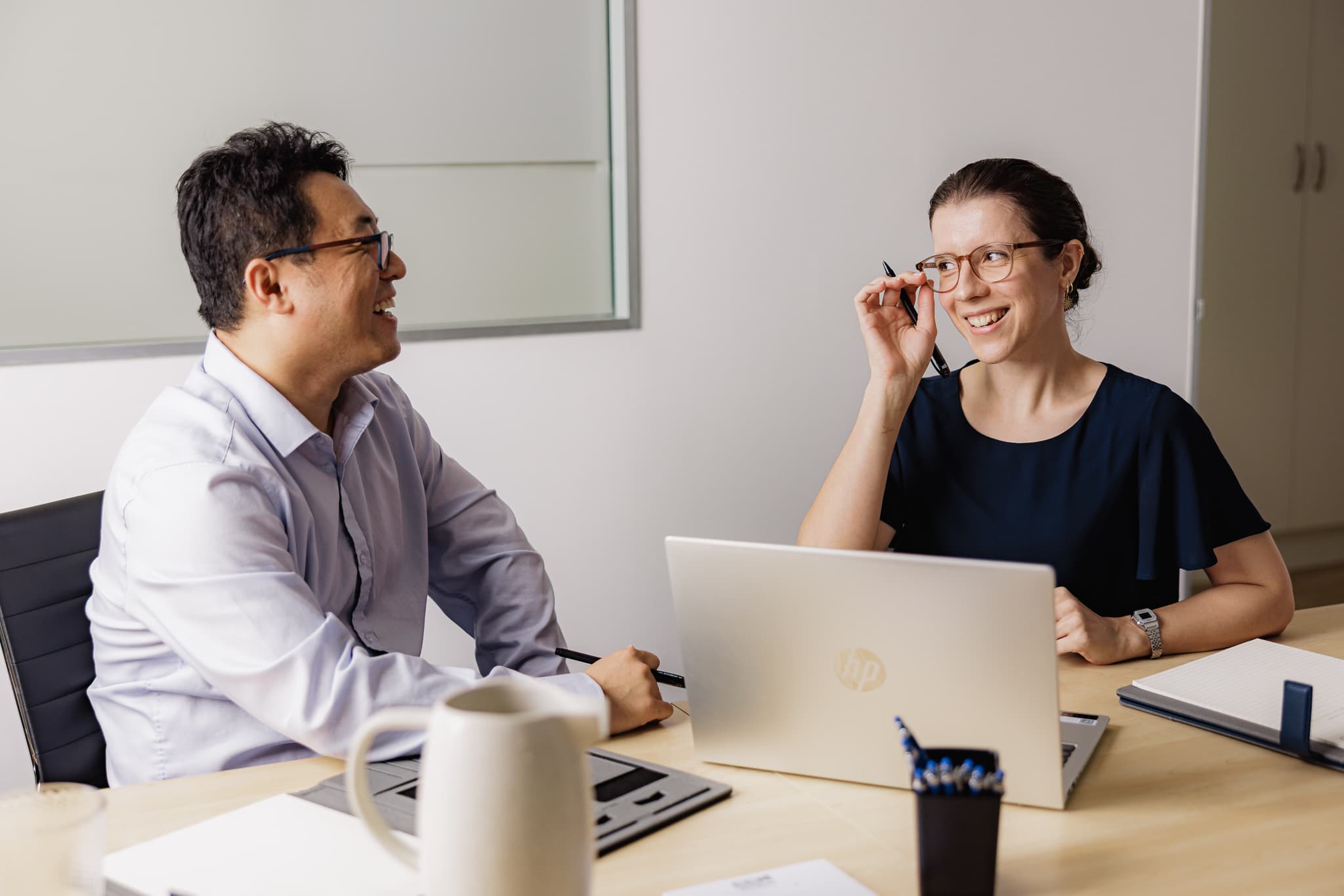 EEA Advisory adviser reviewing loan structure paperwork with a Brisbane family