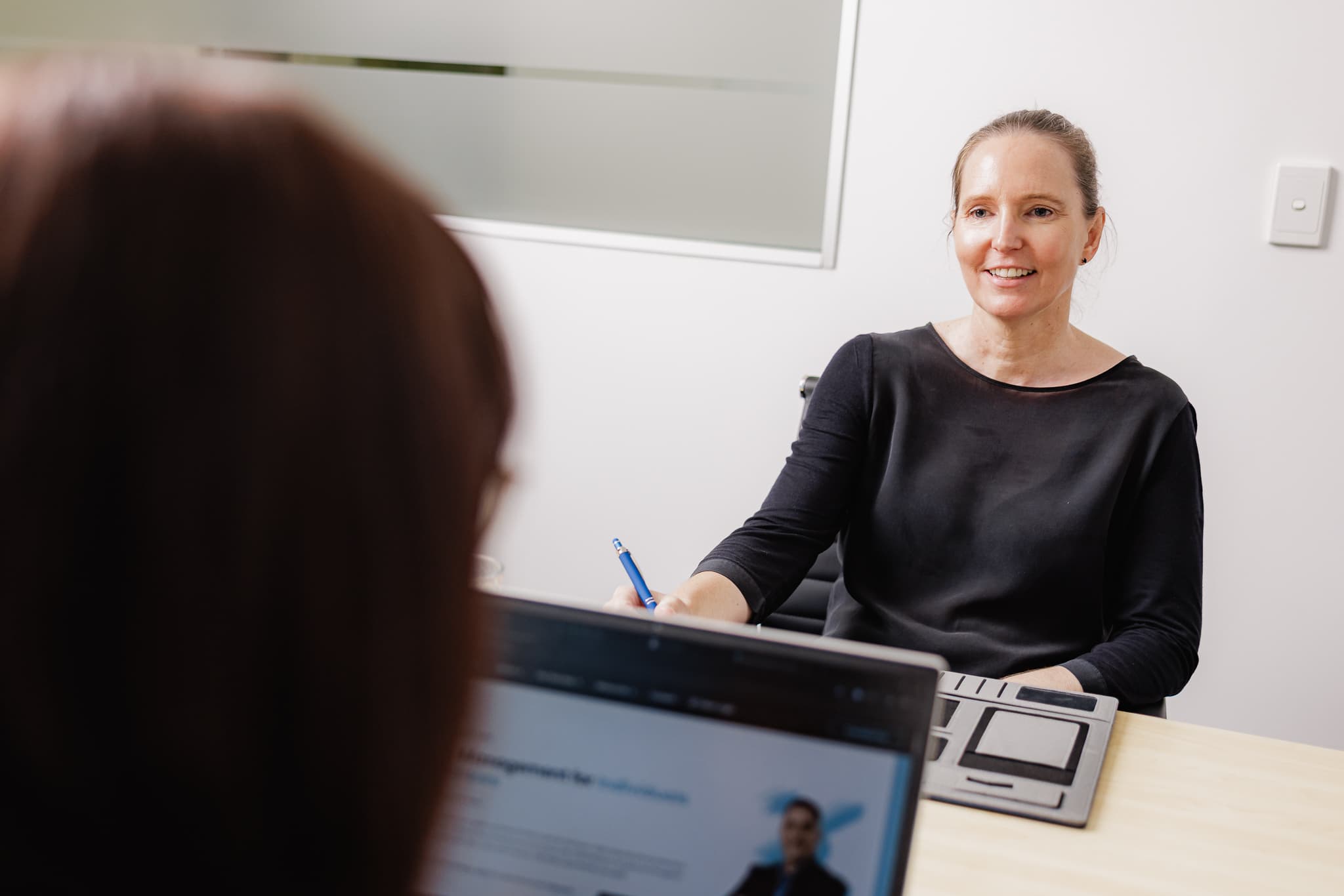 EEA Advisory tax planner reviewing documents at the Capalaba office