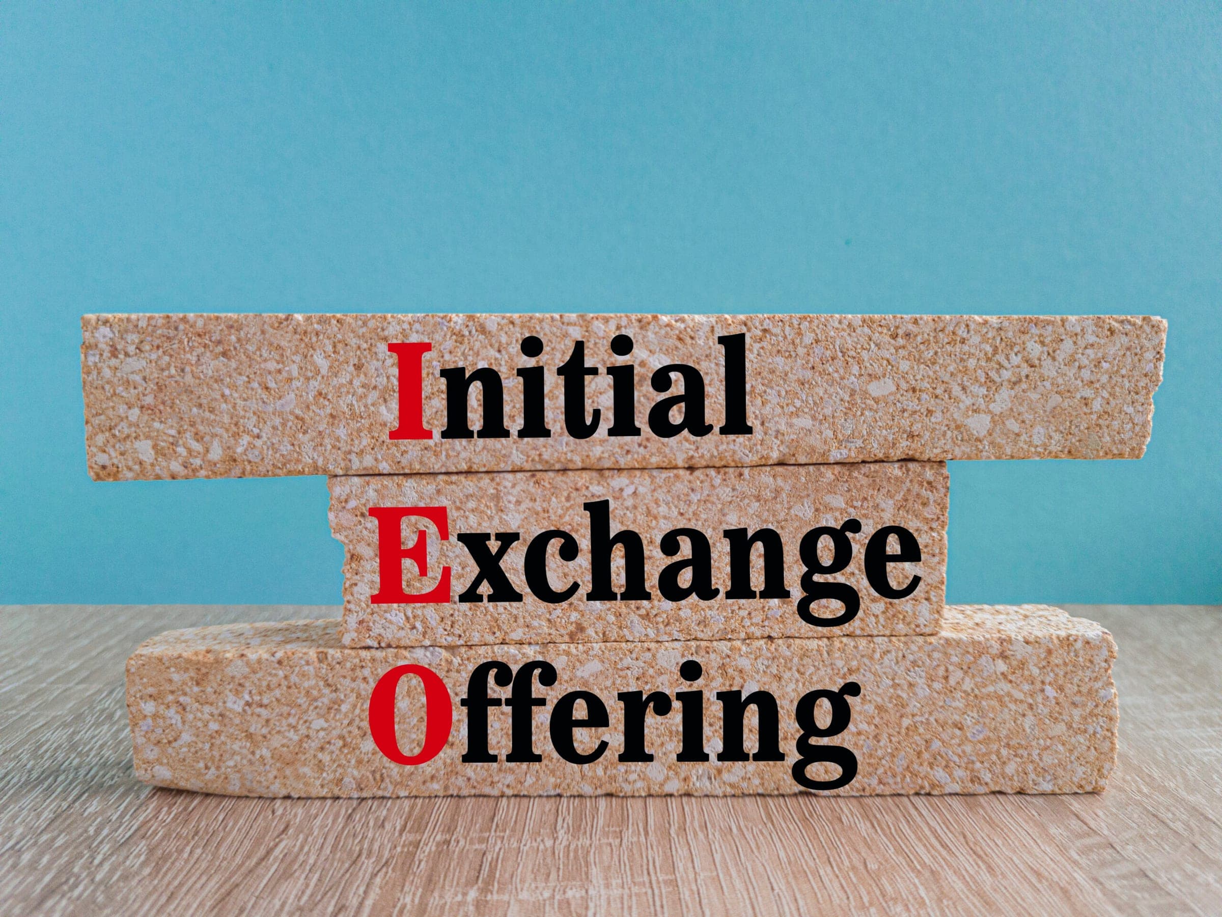 Wooden blocks with Initial Exchange Offering text for CGT blog post feature