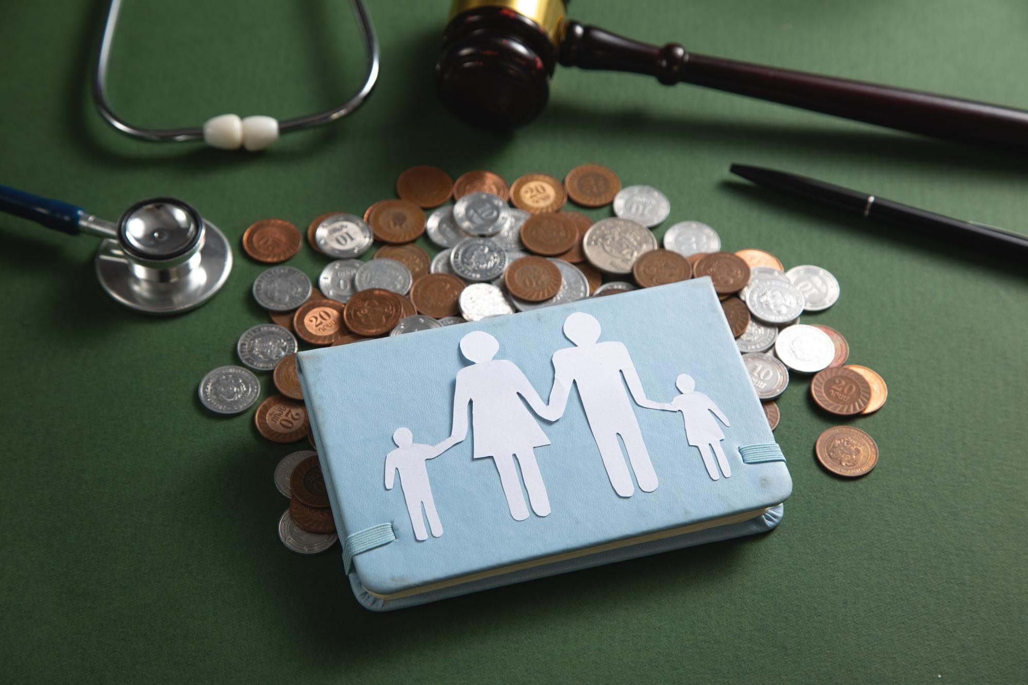 Medical symbols and money representing Medicare Levy Surcharge Thresholds topic.