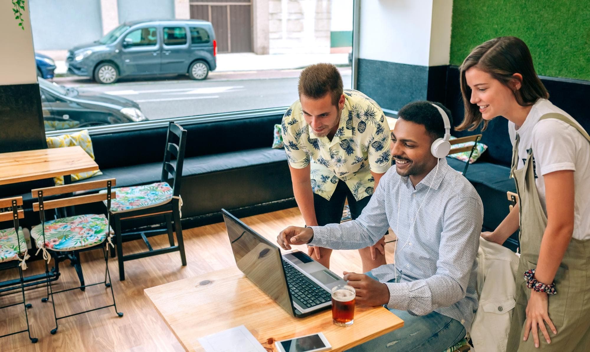 Small business team discussing CGT concessions in Australia while using a laptop.