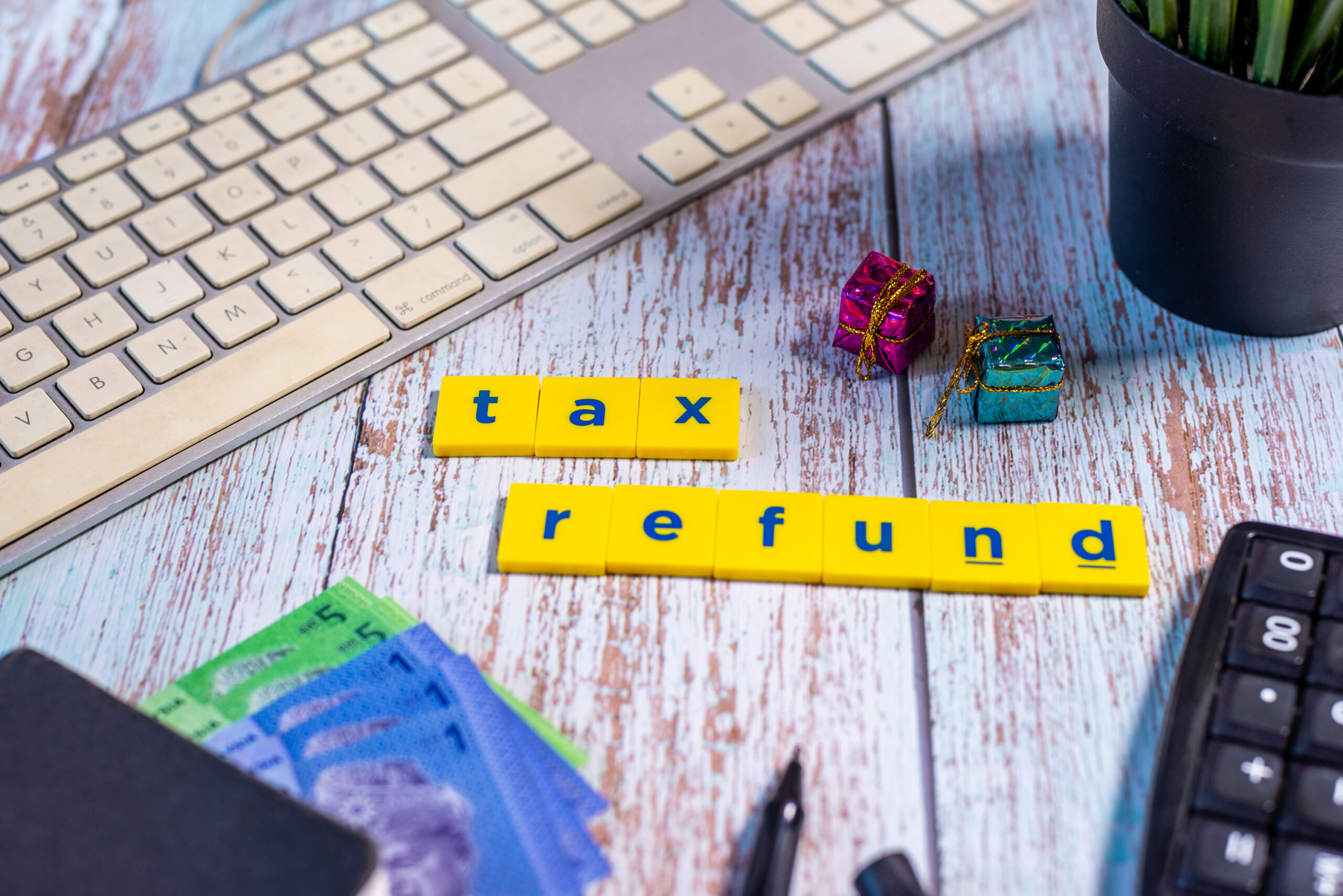 Keyboard, tax refund tiles, calculator, ATO tax changes 2026, Brisbane small business